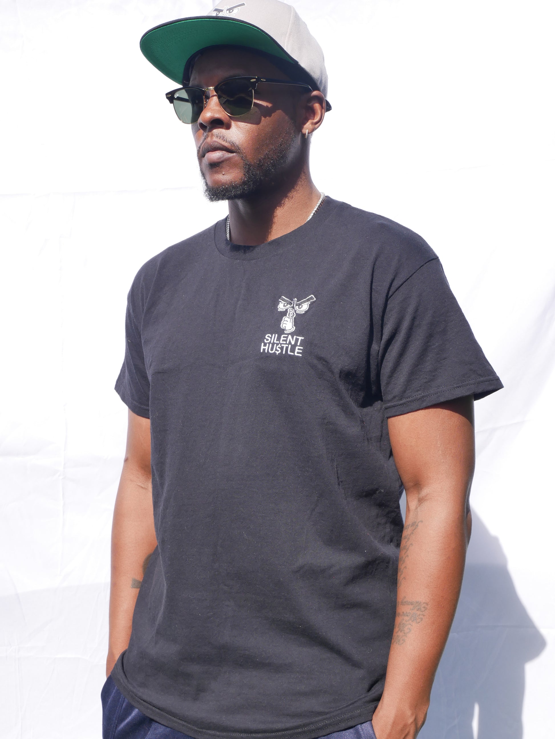 Small embroidered Silent Hustle logo with writing image 1